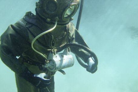 Diving Gear - Person in Green Scuba Diving Suit