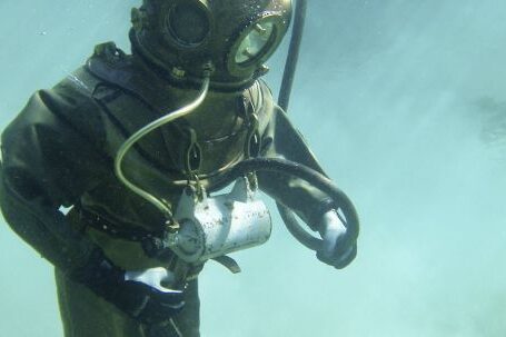 Diving Gear - Person in Green Scuba Diving Suit