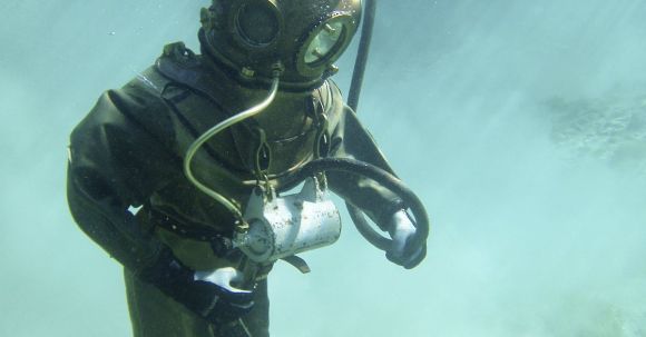 Diving Gear - Person in Green Scuba Diving Suit