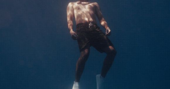 Diving Confidence - Man with Swimming Fins Underwater