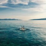 Dive - person in blue water during daytime