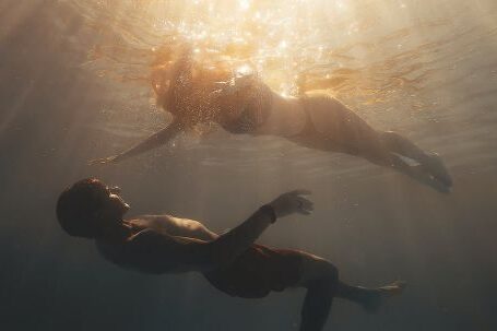 Diving Basics - Sunlight over Couple Diving