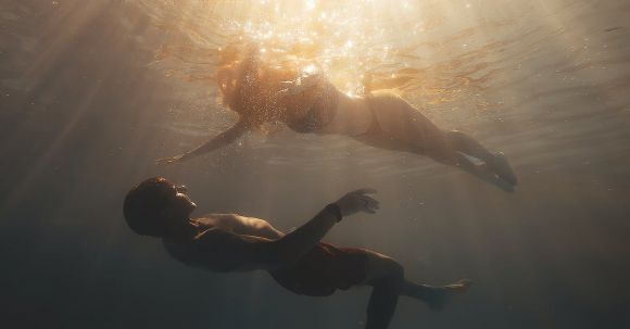 Diving Basics - Sunlight over Couple Diving