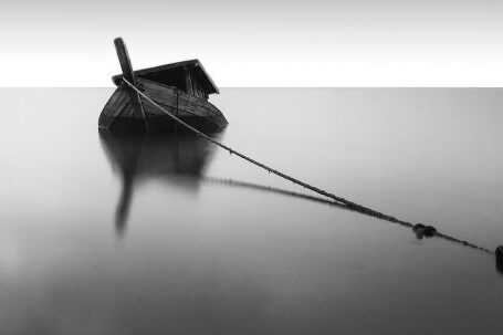 Sunken Ship - Grayscale Photography of Boat on Calm Water