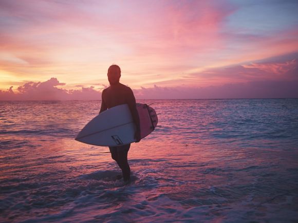 Shipwrecks - man holding surfboard