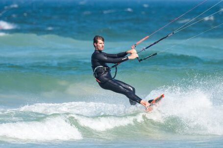 Wetsuit - Man Parasailing While Wearing Wetsuit