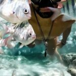 Shipwrecks For Diving - Underwater View of Man with Goggles and Fish
