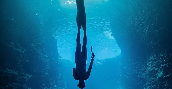 Diving Locations - A Diver Underwater Upside Down