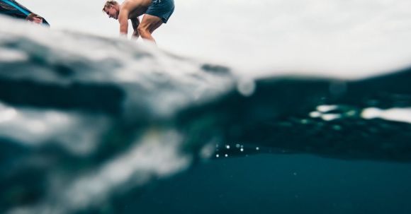 Diving Locations - Man Wearing Blue Shorts