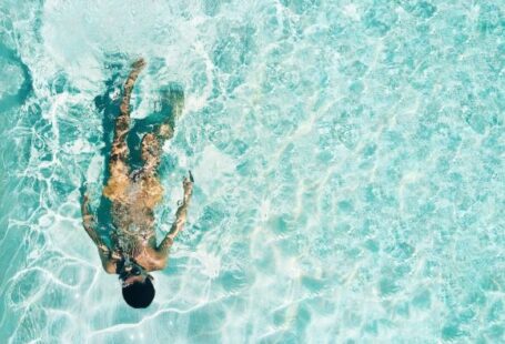 Diving Locations - man snorkeling under water