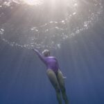 Diving Fins - A Woman Diving in the Sea 