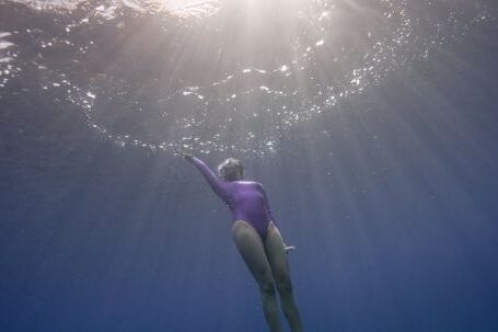 Diving Fins - A Woman Diving in the Sea 