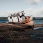 Sunken Ship - White and Rusty Boat on Seashore