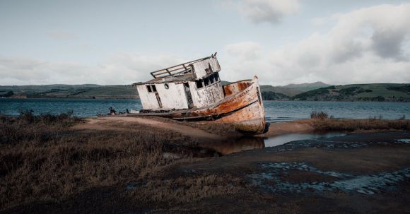 Sunken Ship - White and Rusty Boat on Seashore