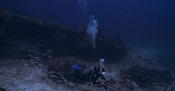 Shipwrecks For Diving - Scuba Diver Swimming near Shipwreck Underwater