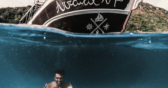 Diving Boat - Man in Black Shorts Jumping on Blue Pool