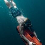 Diving Mask - Man Freediving in Sea with Underwater Scooter