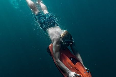 Diving Mask - Man Freediving in Sea with Underwater Scooter
