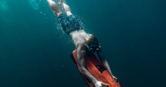 Diving Mask - Man Freediving in Sea with Underwater Scooter