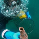 Scuba Diving - Scuba Diver on Deep Sea Holding a Net