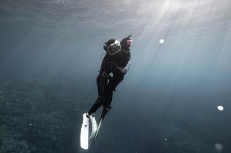 Scuba Diving - Diver in Scuba Gear Swimming Towards Surface