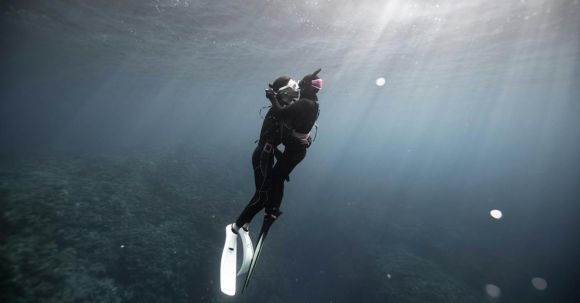 Scuba Diving - Diver in Scuba Gear Swimming Towards Surface