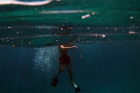 Diving - Man in Black Shorts in Water