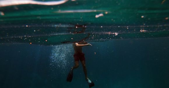 Diving - Man in Black Shorts in Water