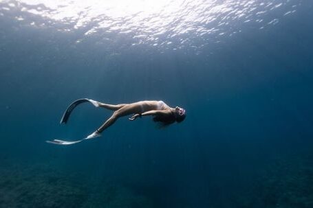 Snorkel - Anonymous graceful woman snorkeling in ocean