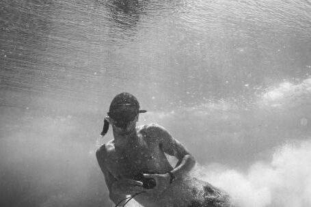 Snorkeling - A Man Holding a Camera Underwater