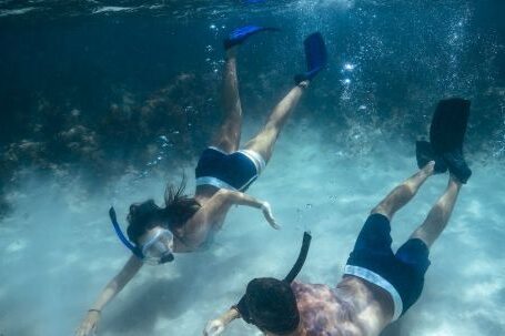 Snorkeling - Man and Woman Snorkeling