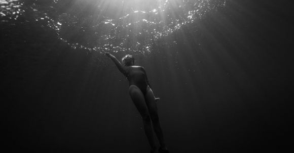 Shipwrecks For Diving - Woman Underwater Swimming Towards Surface
