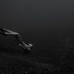 Snorkeling - Monochrome Photo of a Person Underwater