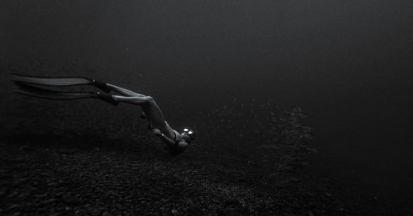 Snorkeling - Monochrome Photo of a Person Underwater