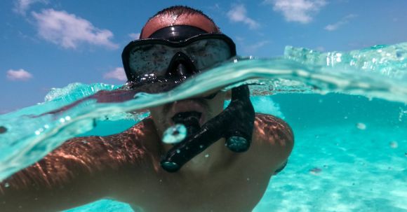 Diving Mask - A Man Snorkeling