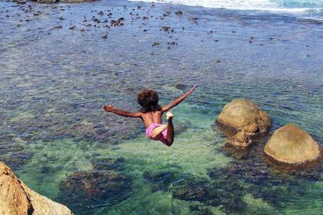 Diving - Child Diving Off Cliff Into Sea