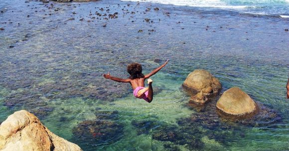 Diving - Child Diving Off Cliff Into Sea