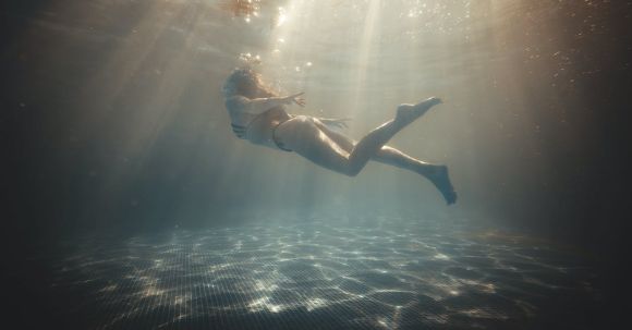 Diving Locations - Sunlight over Diving Woman