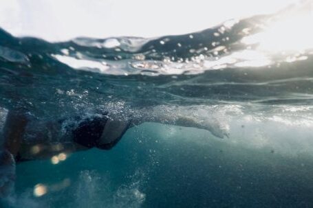 Underwater - Woman Swimming In Body Of Water