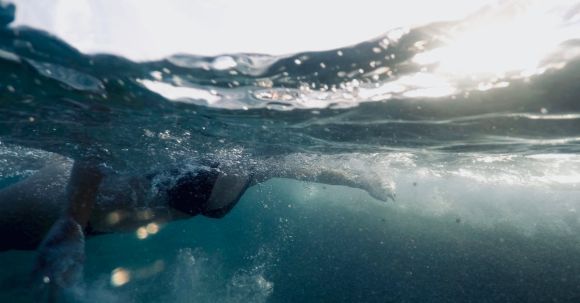 Underwater - Woman Swimming In Body Of Water