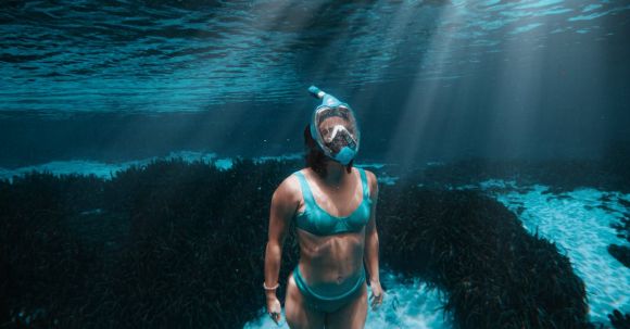 Diving Mask - Woman in Swimsuit Diving in Sea