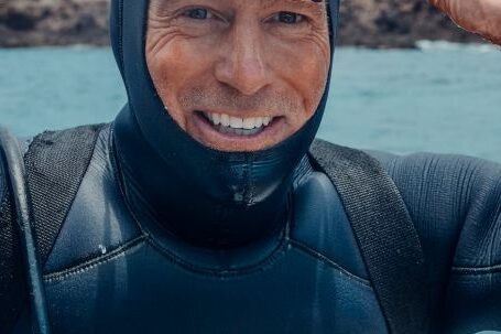 Scuba Diving - Man in Black and Blue Wetsuit and Black Goggles