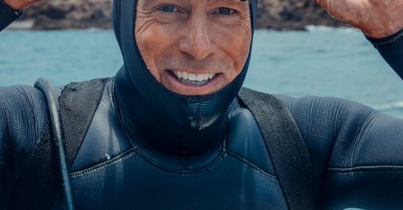 Scuba Diving - Man in Black and Blue Wetsuit and Black Goggles