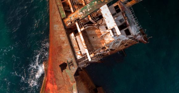Sunken Ship - An Old Rusty Ship Floating on the Sea