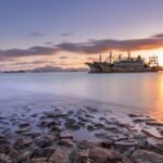 Shipwrecks - Sunset over Shore and Shipwrecks behind