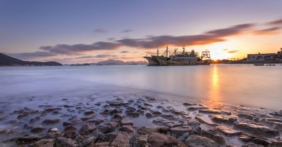 Shipwrecks - Sunset over Shore and Shipwrecks behind