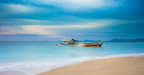 Sunken Ship - Brown Boat on Sea Shore