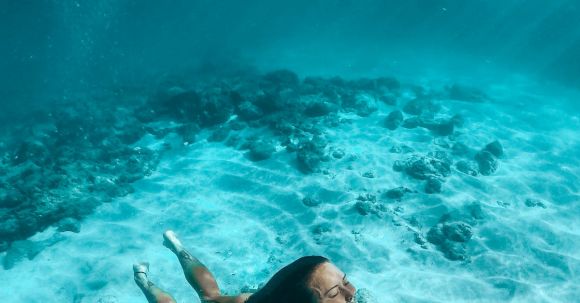 Shipwrecks For Diving - A Woman in Bikini Under Water