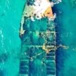Sunken Ship - Aerial View of a Ship Wreck on Body of Water