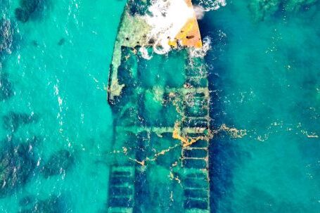 Sunken Ship - Aerial View of a Ship Wreck on Body of Water